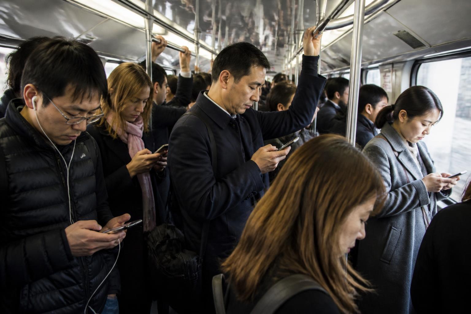 Packed rush-hour commuter train interior